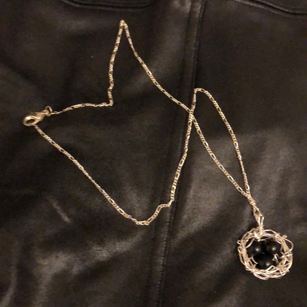 Silver bird nest charm necklace